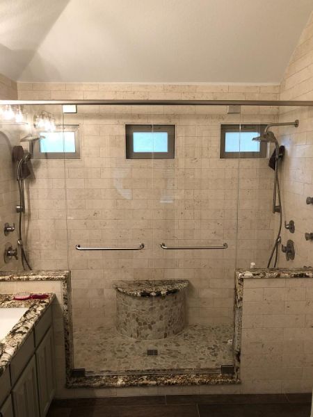 Example of pivoting double glass shower door by Weatherford Glass