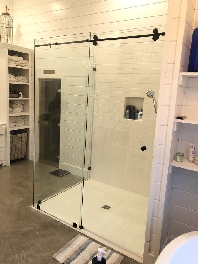 Barn style sliding glass shower door by Weatherford Glass
